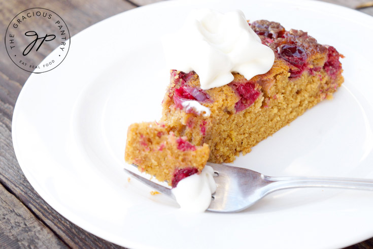 A slice of Skillet Cranberry Upside Down Cake Recipe Served on a white plate.