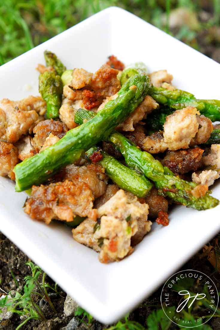 Ground Turkey dinner with asparagus spears in white dish