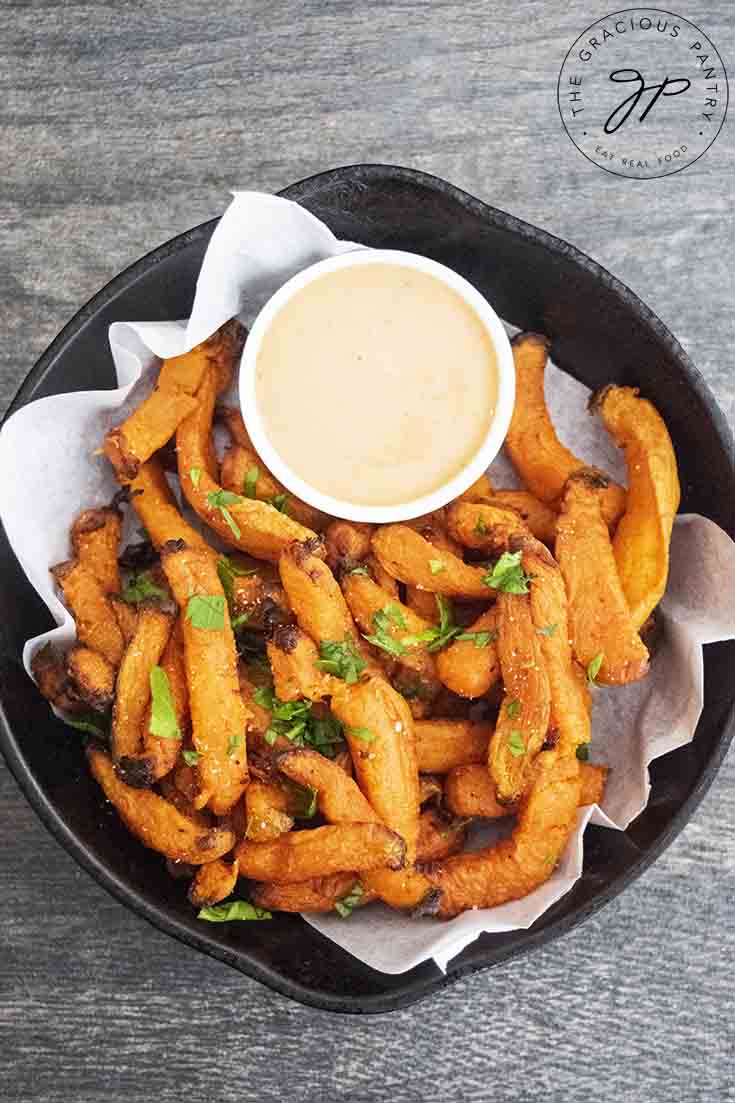 An overhead view of these Air Fryer Sweet Potato Fries and a side of dipping sauce.