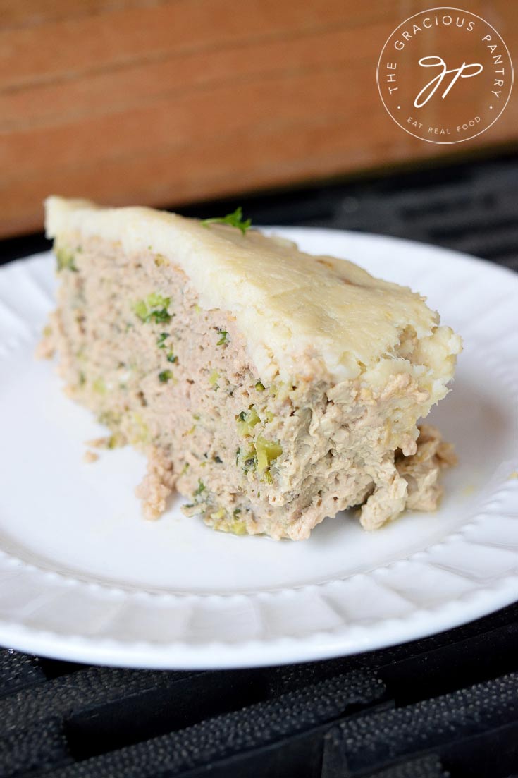 Clean Eating Turkey Vegetable Meatloaf Casserole recipe sliced and placed on a white plate. 