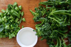 Chopped broccolini with stems and florets separated.