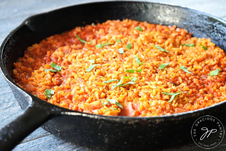 A view from the side of the skillet shows this Clean Eating Salsa Rice up close.