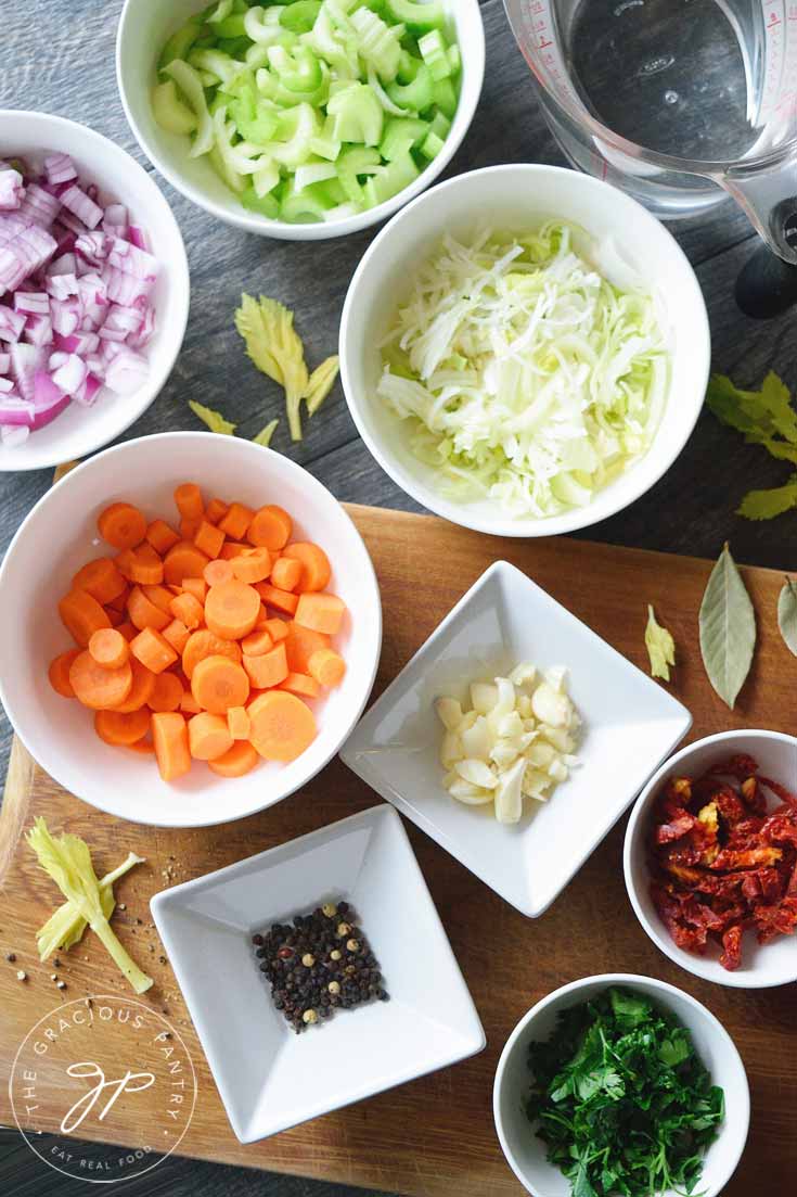 Mise en place for this Clean Eating Vegetable Stock Recipe shows all the individual ingredients that go into the stock pot.