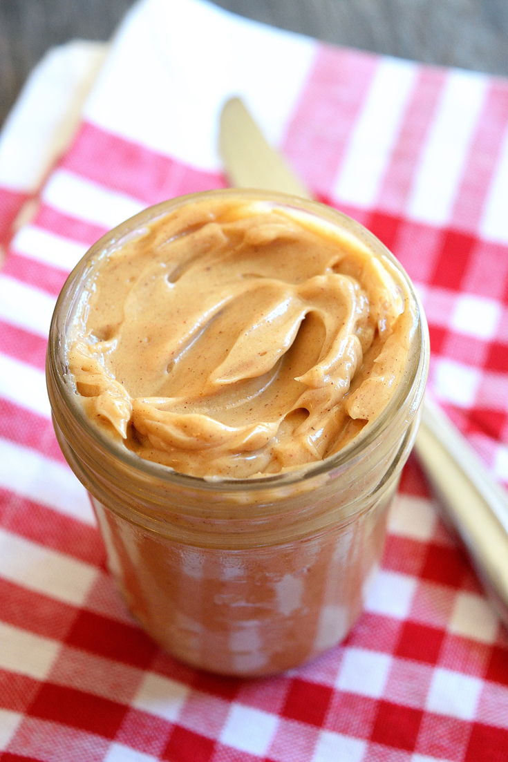 Looking down into the open jar of this Clean Eating Whipped Pumpkin Spice Maple Butter, it looks delicious and ready to spread on your morning toast.