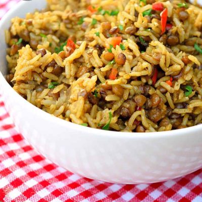 A white bowl filled with Lentils and Rice