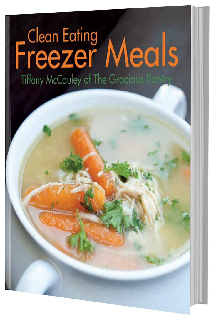 This image shows the cover of this Clean Eating Freezer Meals Cookbook