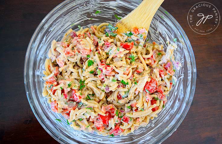 An overview shot of this clean eating easy macaroni salad recipe, looking down into the bowl at this colorful dish.