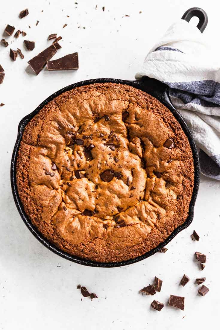 And overhead shot shows this Clean Eating Skillet Chocolate Chip Cookie just baked and waiting for some ice cream and a spoon.