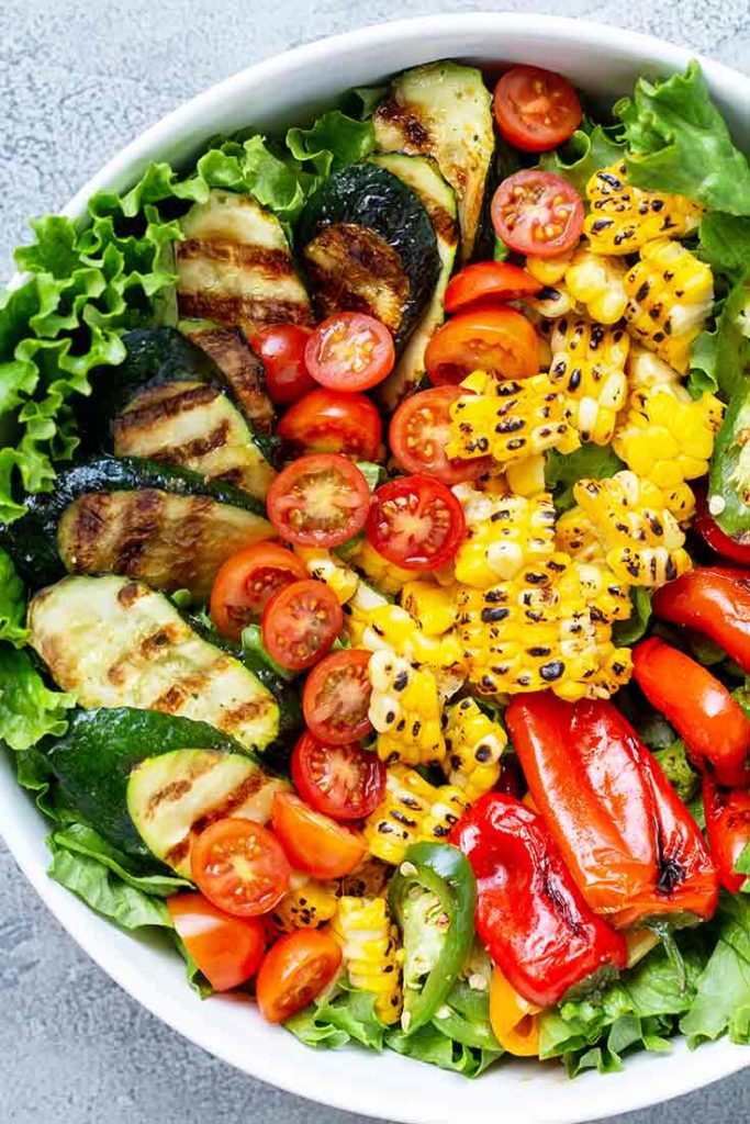 An overhead shot looking down into this beautiful bowl of Clean Eating Grilled Garden Salad. The colors are like a grilled veggie rainbow!