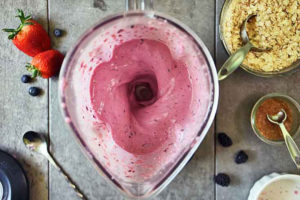 Blending the smoothie in a blender.