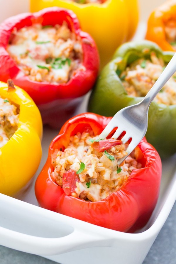 ground turkey stuffed peppers in white casserole dish