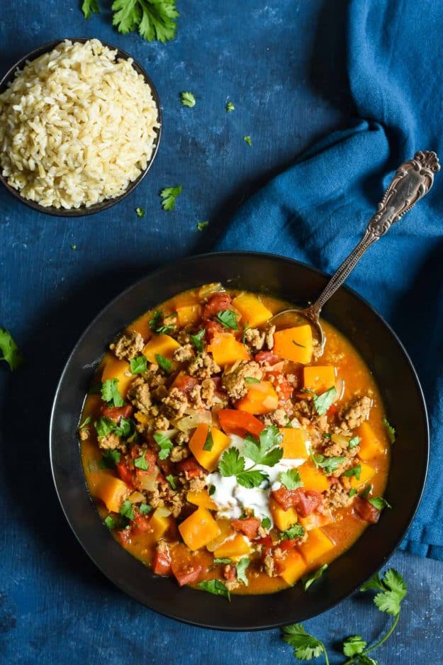 cast iron skillet of turkey butternut squash curry