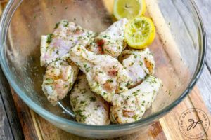 Step 4 of this Air Fryer Chicken Wings Recipe shows the spices mixed into the chicken, coating the surfices.