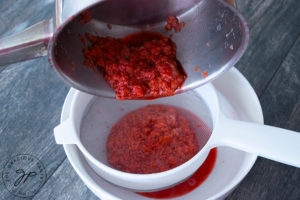 Step two shows the raspberries being put through a strainer to extract the juice.