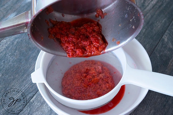 Step two shows the raspberries being put through a strainer to extract the juice.