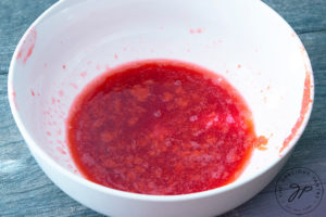 Step four shows the finished juice and seedless pulp in a white bowl, ready to make raspberry lemonade with.