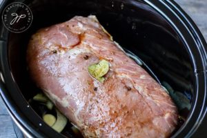 Step three shows the pork loin wet from pouring the sauce over the top.