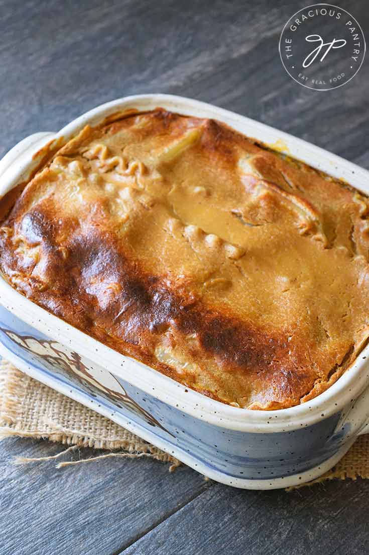 This Butternut Squash Lasagna sits, uncut, in it's casserole dish, freshly out of the oven.