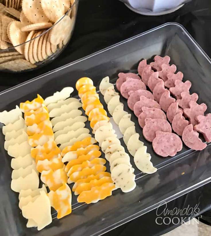 A platter of Halloween shaped cheeses cut with cookie cutters are the perfect, savory, health halloween treats.