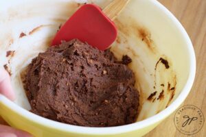 Step one in making these Flourless Brownies is to mix all the ingredients in a medium mixing bowl until well combined.