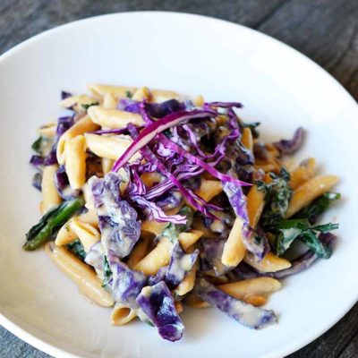 A side view of this Red Cabbage Pasta is a white bowl, ready to serve.