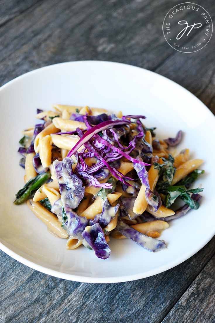 A side view of this Red Cabbage Pasta is a white bowl, ready to serve.