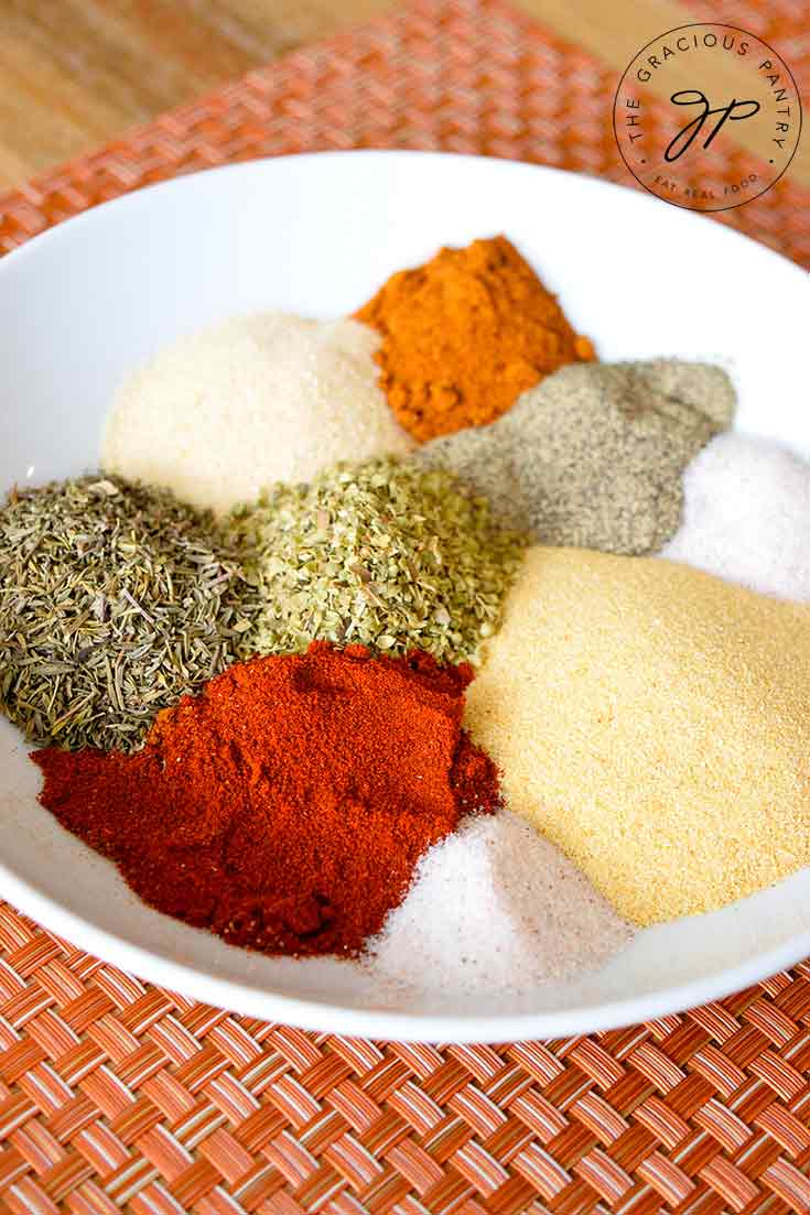 The measured spices sit in the bowl, each next to another like little mountains of spices.