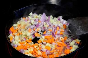 Step one of this ground turkey meatloaf recipe is to chop and saute your vegetables.