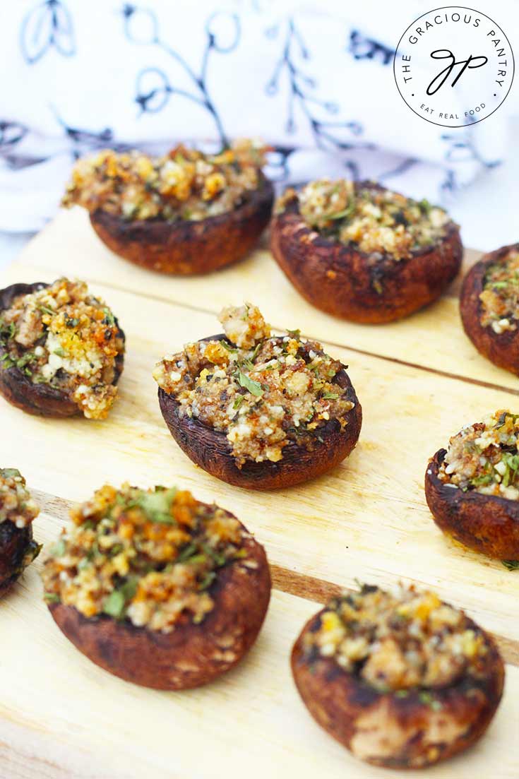 Stuffed Mushrooms sit on a serving tray, ready to serve to guests.