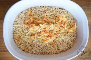 Add grated apple to the oats.