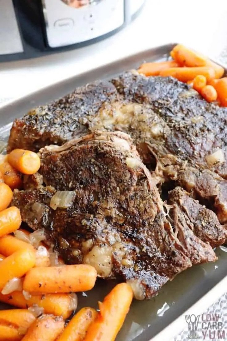 Keto Pot Roast on a serving platter with baby carrots, in this guide to 15 Clean Eating Easter Recipes