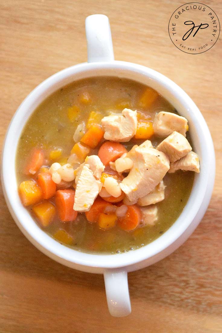 An overhead view looking down into a bowl filled with this Chicken Stew Recipe With Butternut Squash.