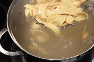 Remove the pasta with a slotted spoon.