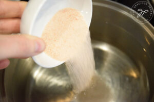 A large stock pot with water and salt getting ready to boil for making homemade pasta.