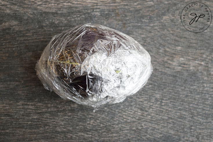 Option three for freezing avocados is to remove the seed, put the halves back together, wrap in plastic wrap and place in the freezer.