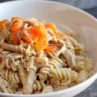 A sideview of a white bowl filled with this Maple Chicken Recipe.