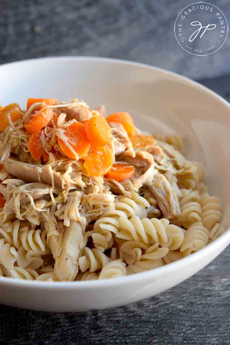 A sideview of a white bowl filled with this Maple Chicken Recipe.