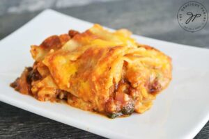 A final slice of this Homemade Lasagna Recipe on a white plate, ready to serve.