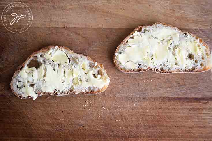 Step one of this Tuna Melt Recipe is to butter the bread on one side.