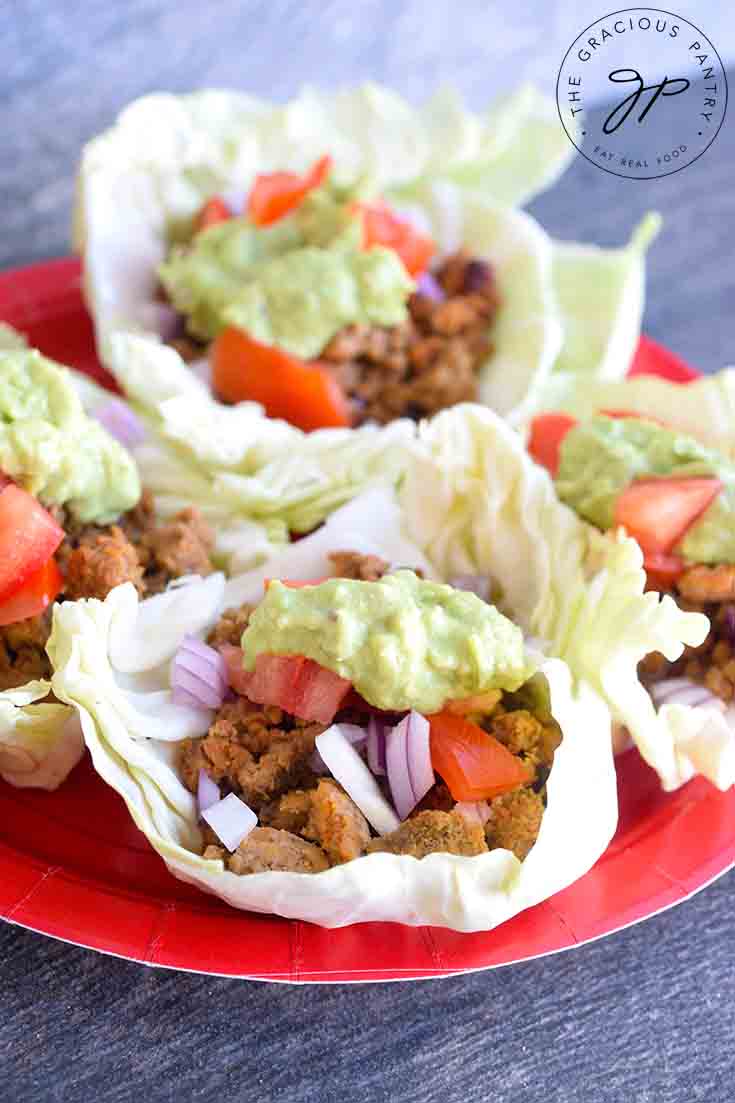 Cabbage Leaf Tacos filled with meat, tomatoes, fresh onions and homemade guacamole.