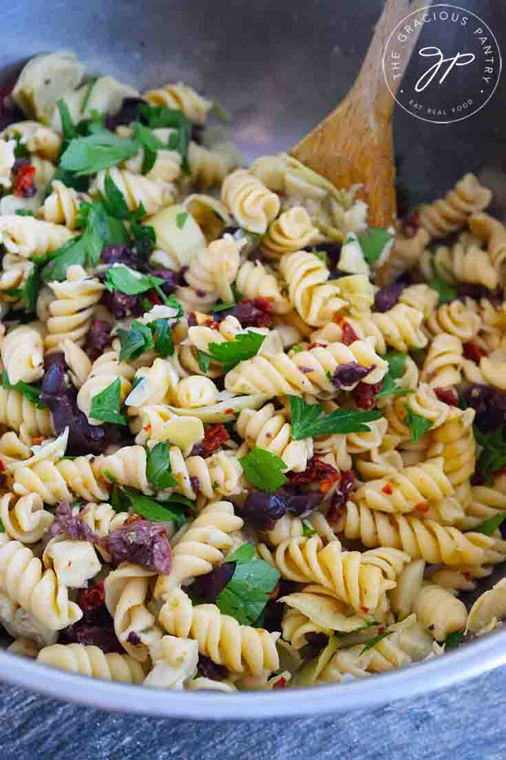 An overhead view of this Greek Pasta Salad Recipe, still in it's mixing bowl, ready to serve.