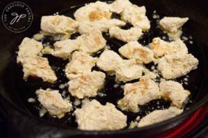 Step six of this Easy Orange Chicken Recipe is to cook the chicken. Either in a skillet or in an air fryer.