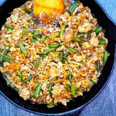 An overhead view of this Teriyaki Turkey Skillet Recipe shows bits of turkey, carrots and green beans all tossed with a delicious teriyaki sauce.