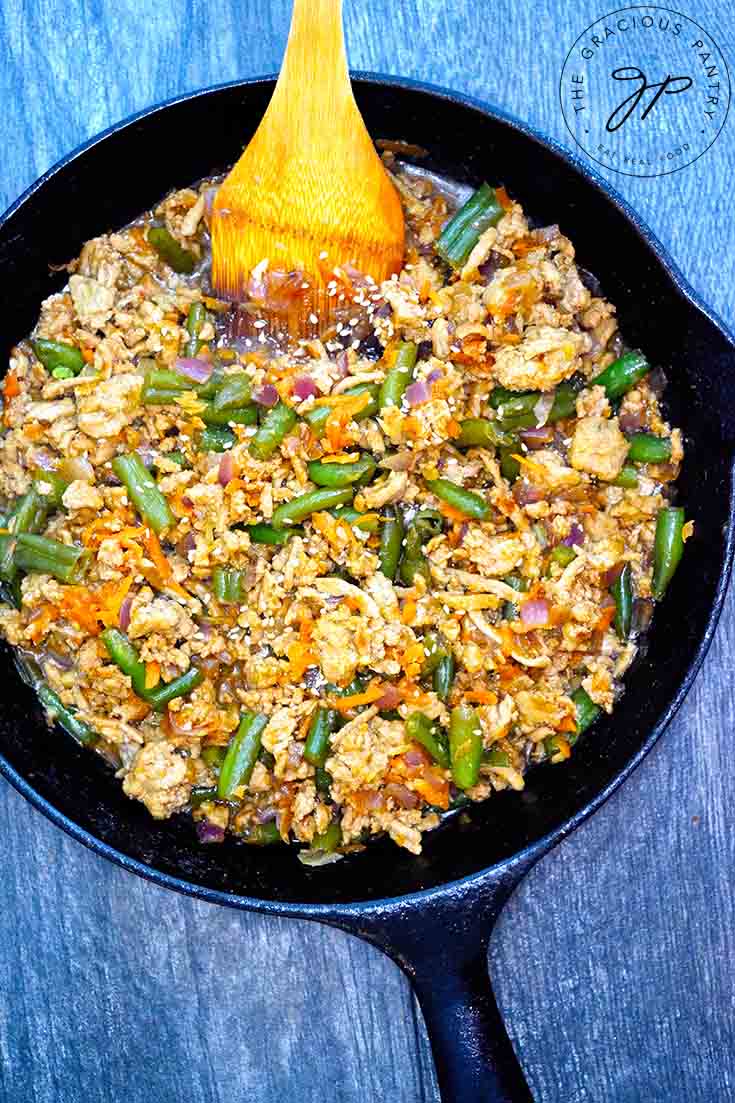 An overhead view of this Teriyaki Turkey Skillet Recipe shows bits of turkey, carrots and green beans all tossed with a delicious teriyaki sauce.