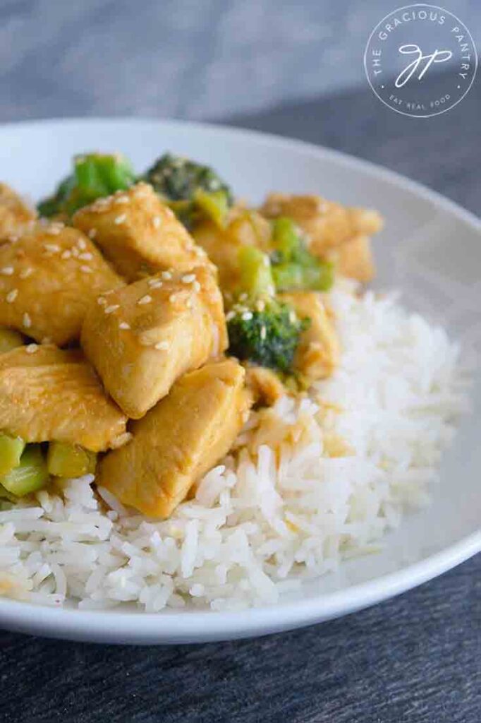 A bowl of this Easy Teriyaki Chicken Recipe served over a bed of rice.