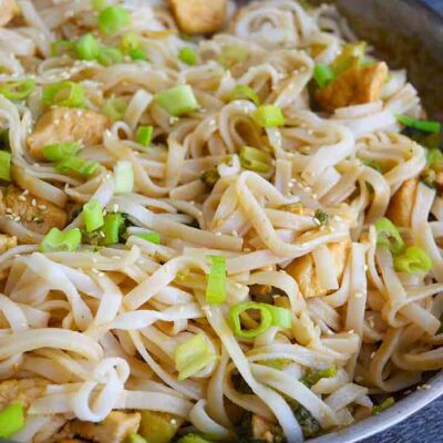 A side view of this Easy Teriyaki Chicken made with rice noodles and still in the skillet.