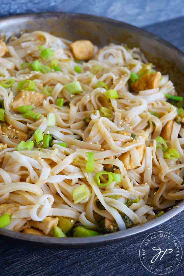 A side view of this Easy Teriyaki Chicken made with rice noodles and still in the skillet.