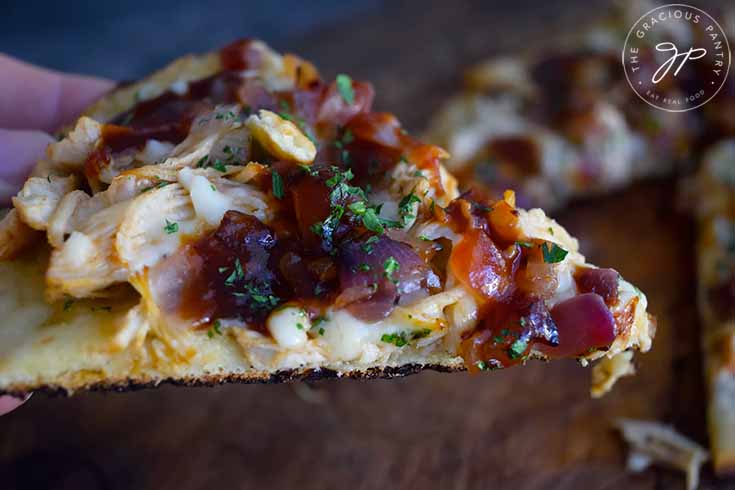 A side view of a slice of this Naan Pizza.