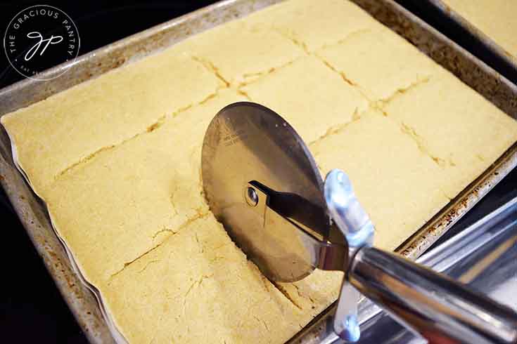 Cutting the pancakes with a pizza cutter.