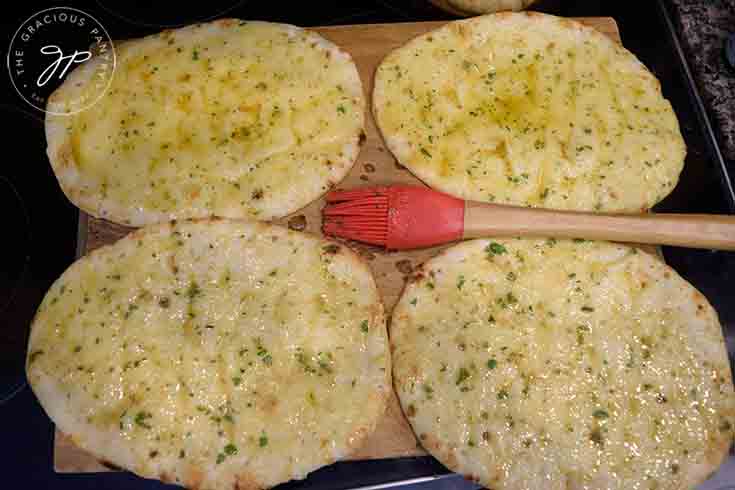 Brush the naan with the oil mixture.